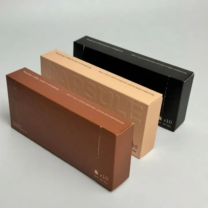 Three closed custom coffee pod boxes representing the coffee packaging category