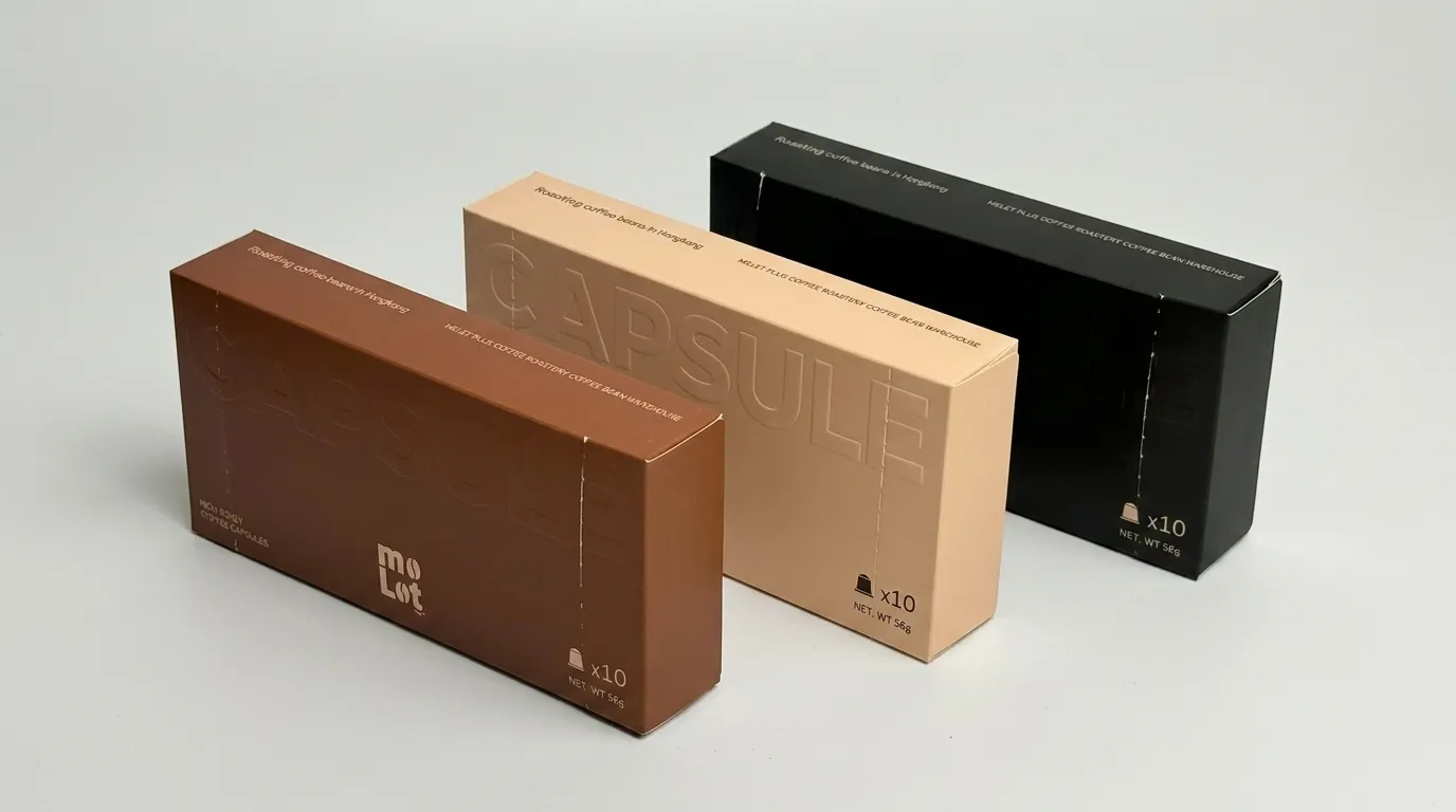 Three closed custom coffee pod boxes showing the long horizontal form and side depth