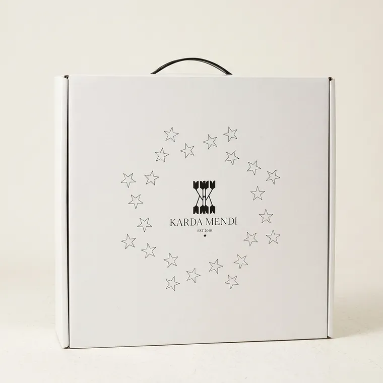 Closed white custom corrugated hat box with printed star artwork and a black plastic carry handle
