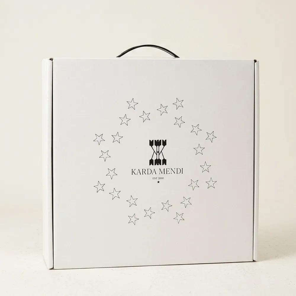Closed white custom corrugated hat box with printed star artwork and a black plastic carry handle