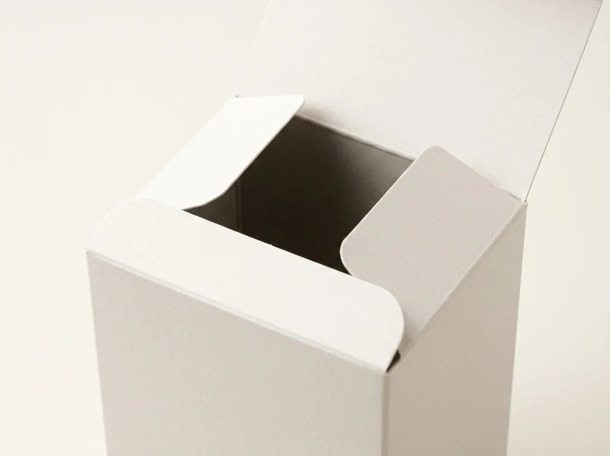 Open ivory folding tea box showing the main tuck flap and two side dust flaps