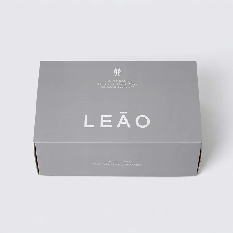 Custom corrugated shoe boxes in gray with silver foil branding and self-locking side construction