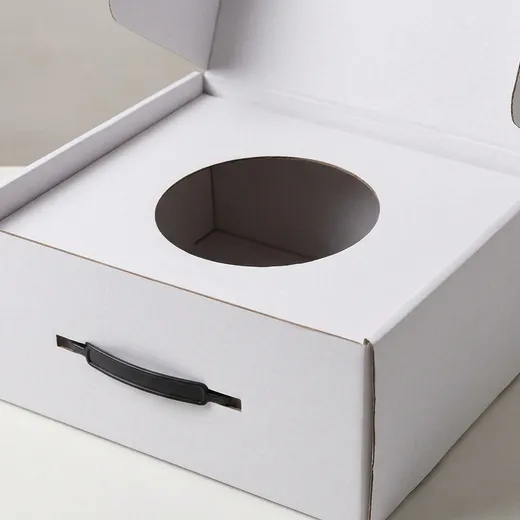 Circular die-cut support opening inside an open white corrugated hat box