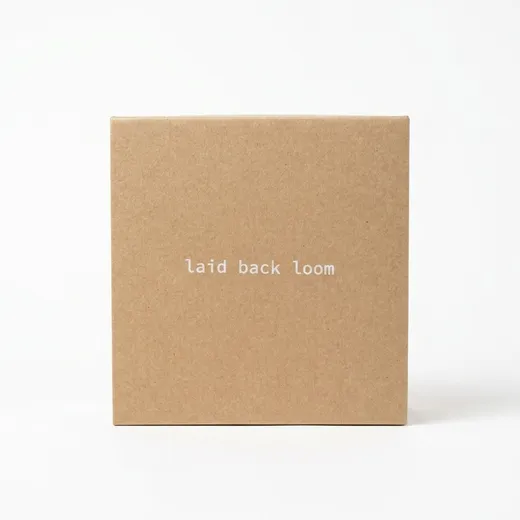 Front-facing closed kraft corrugated belt box with centered white lettering