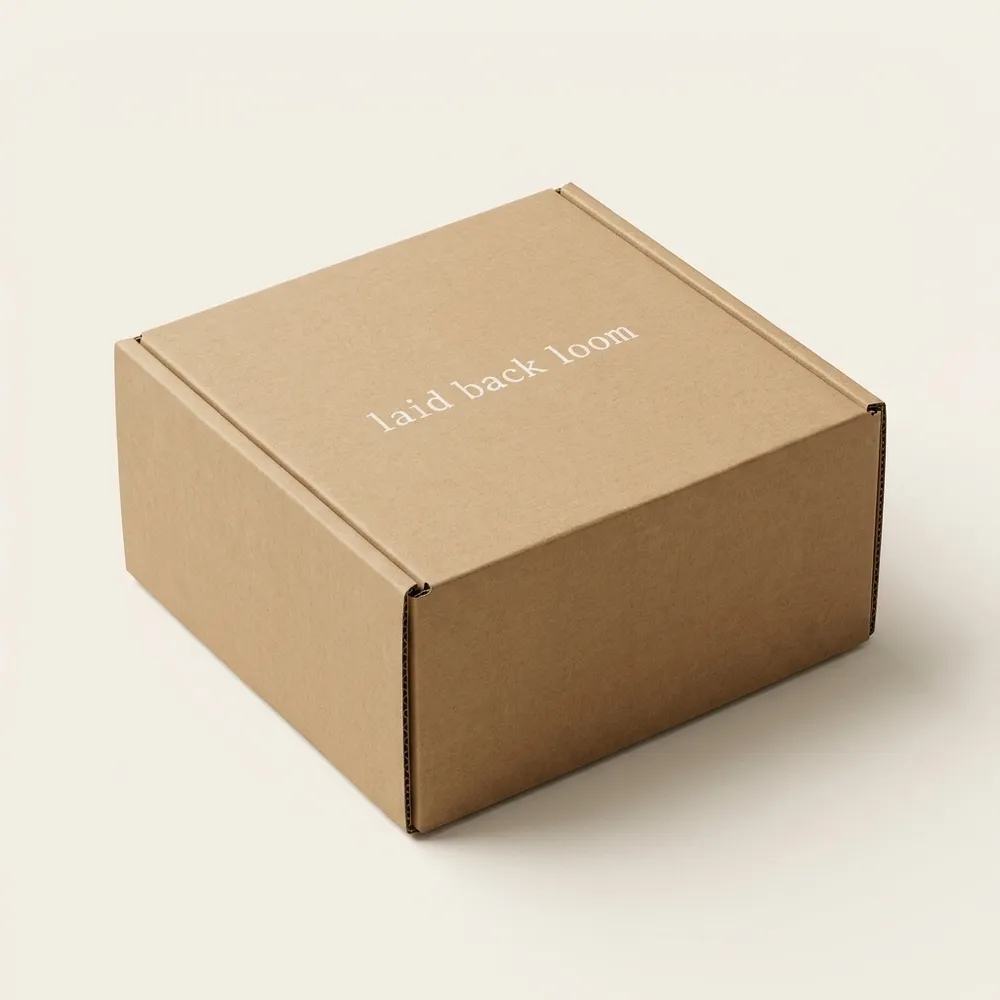 Closed custom kraft corrugated belt box with insert, white printed lettering, and a one-piece hinged lid