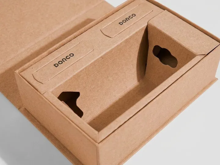 Close-up of a die-cut kraft paper insert inside a magnetic rigid box