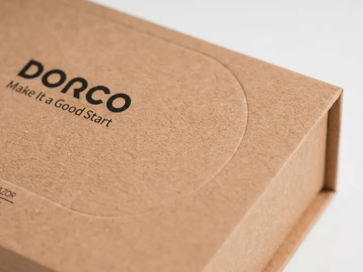Close-up of black printing and pressed line on textured kraft paper wrap