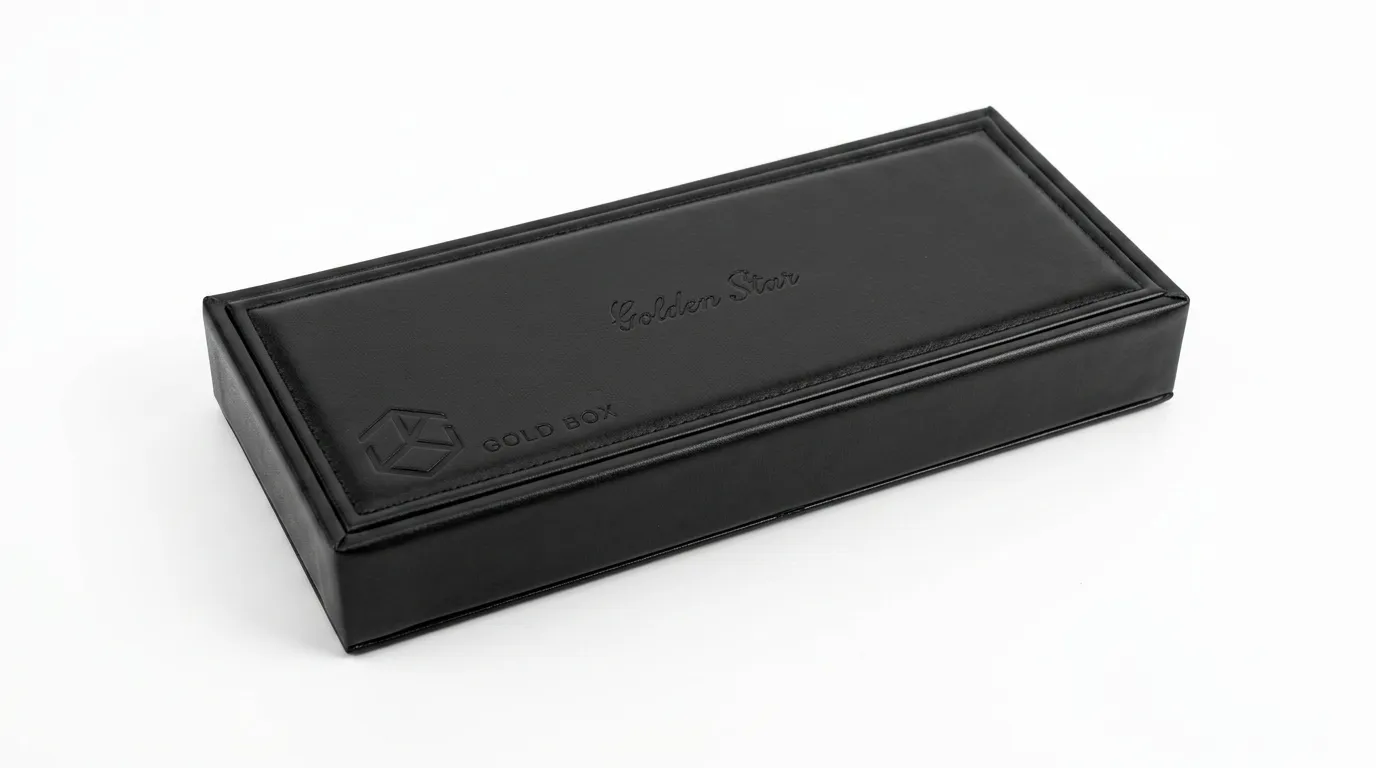 Closed slim black PU leather tie box with raised perimeter detailing and debossed logo