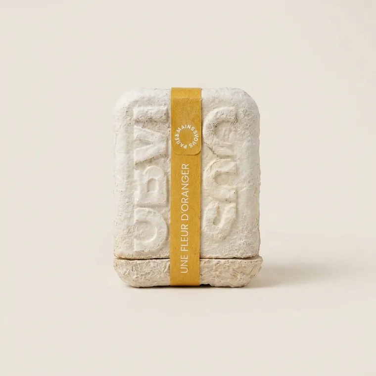 Closed two-piece mycelium packaging with a kraft paper sleeve