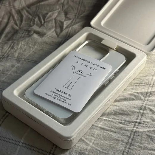 Open hinged molded pulp phone case box showing the fitted cavity