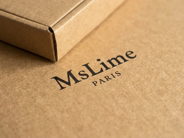 Close-up of black water-based one-color printing on unlaminated recycled kraft board