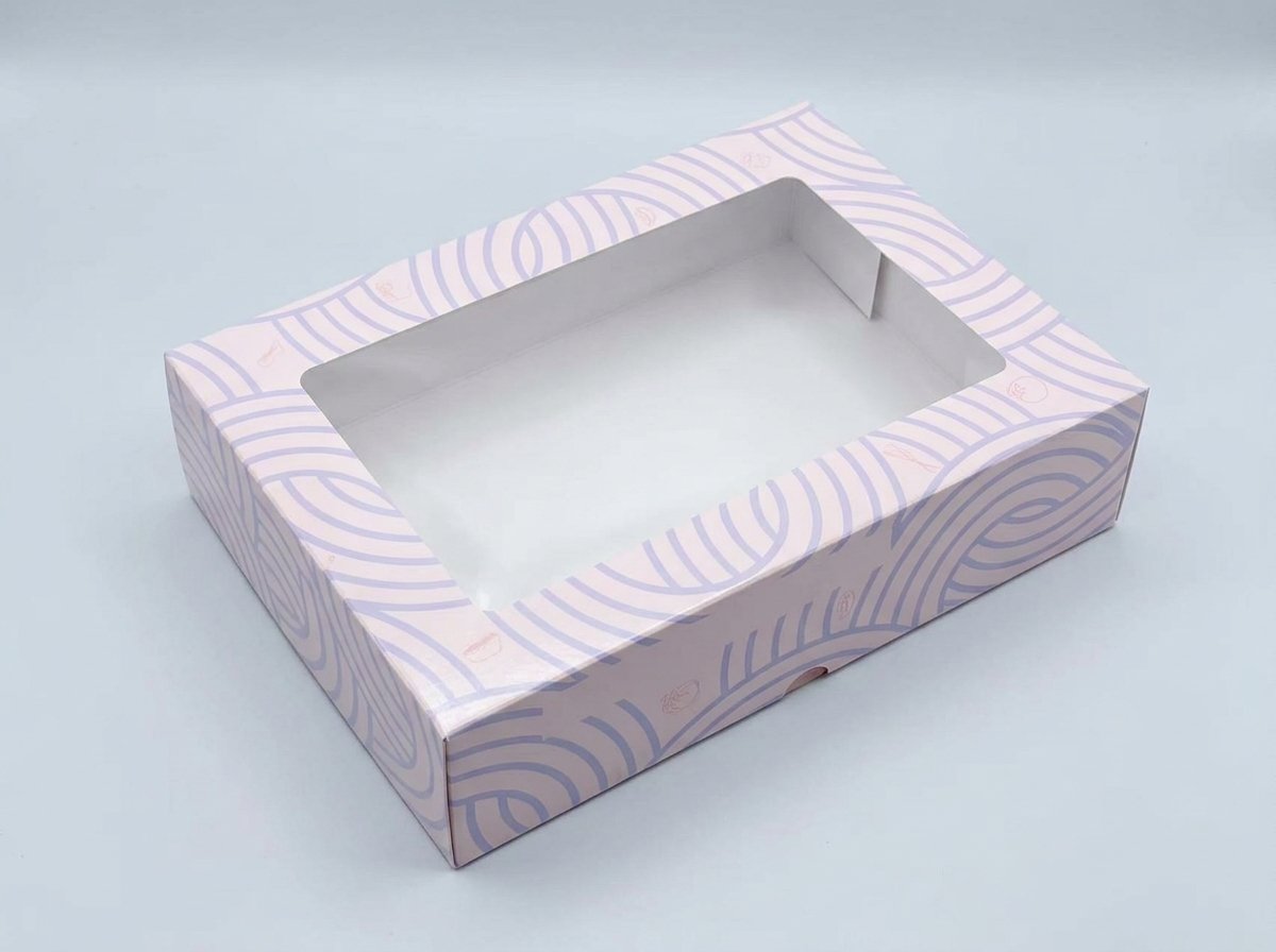 Empty white interior of a pale pink and lavender bakery box with a large clear window